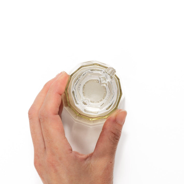 Soy sauce dispenser with frosted plum blossom design and smooth pour spout, featuring a geometric base.