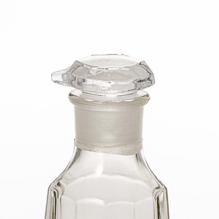 Soy sauce dispenser with frosted plum blossom design and smooth pour spout, featuring a geometric base.