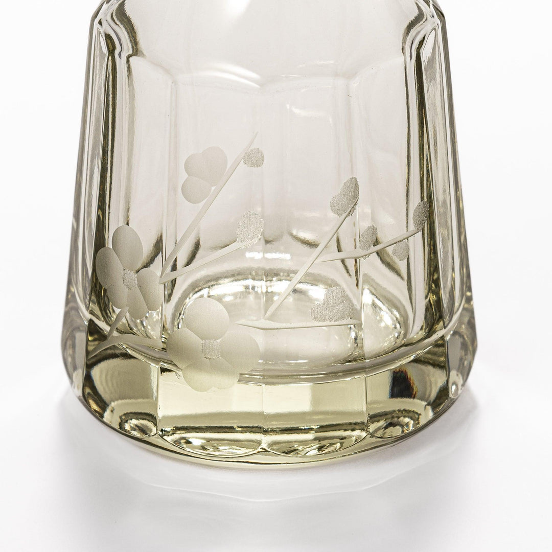 Soy sauce dispenser with frosted plum blossom design and smooth pour spout, featuring a geometric base.