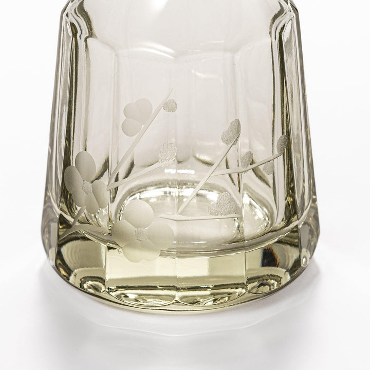 Soy sauce dispenser with frosted plum blossom design and smooth pour spout, featuring a geometric base.