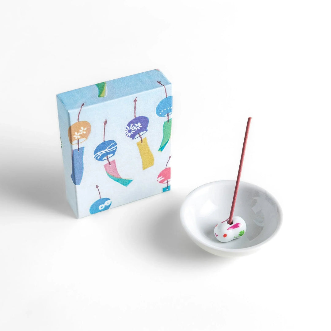 Incense with pink sticks in a wind chime design box evoking a light refreshing fragrance of a gentle summer breeze.