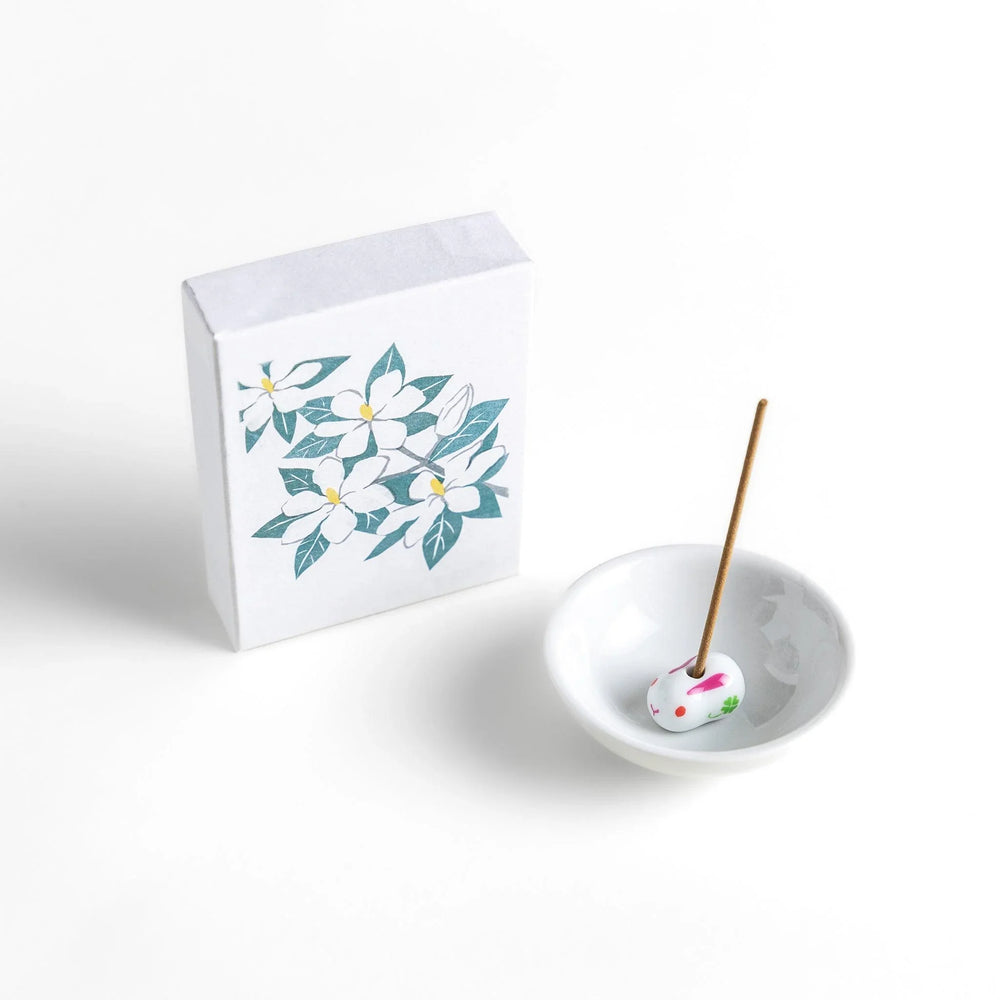 Incense with beige sticks in a gardenia box, offering a rich floral fragrance for a calm and soothing ambiance