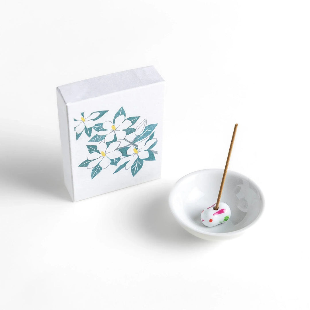 Incense with beige sticks in a gardenia box, offering a rich floral fragrance for a calm and soothing ambiance