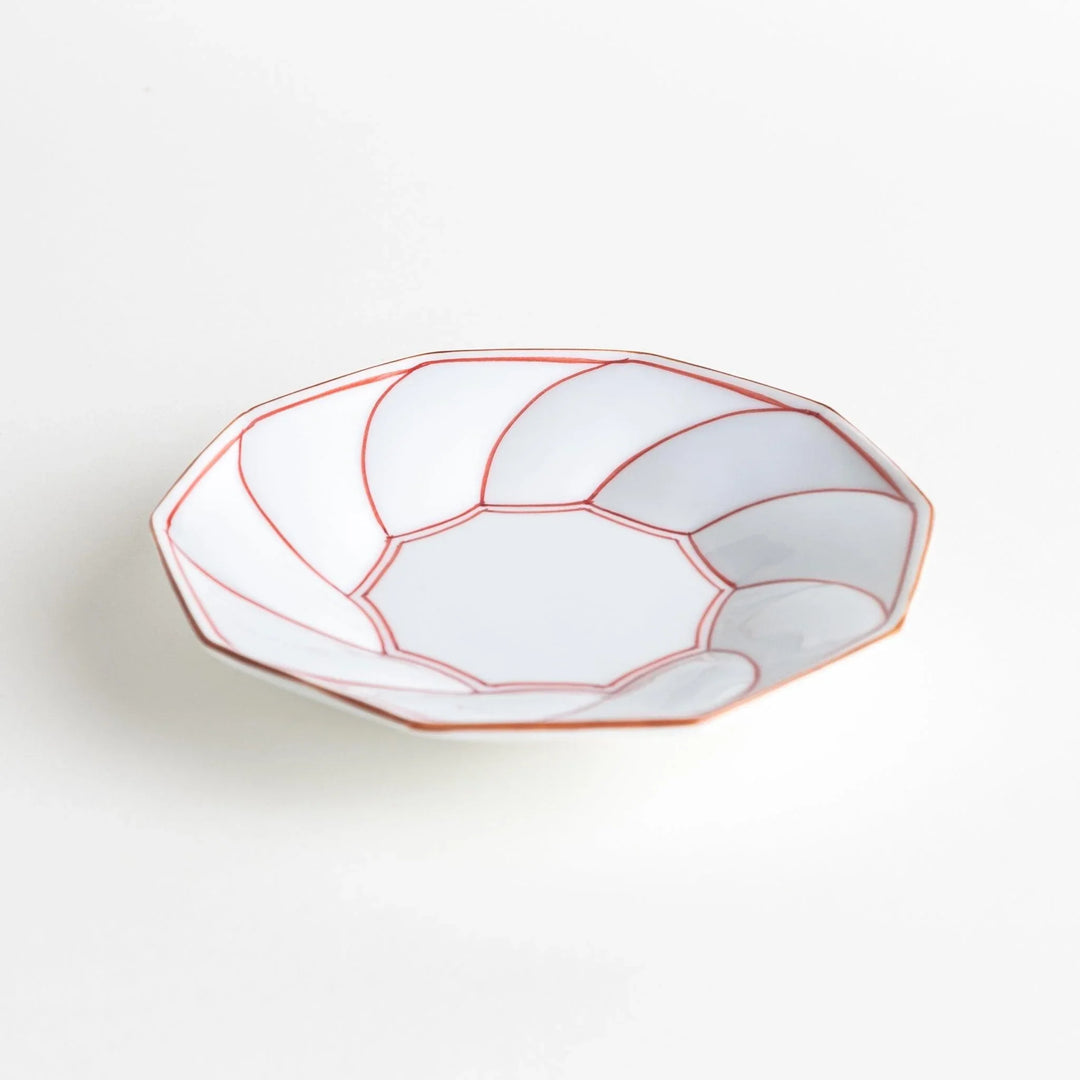 Octagonal dessert plate with a petal design and bowl shape, outlined in blue and red with a brown rim.