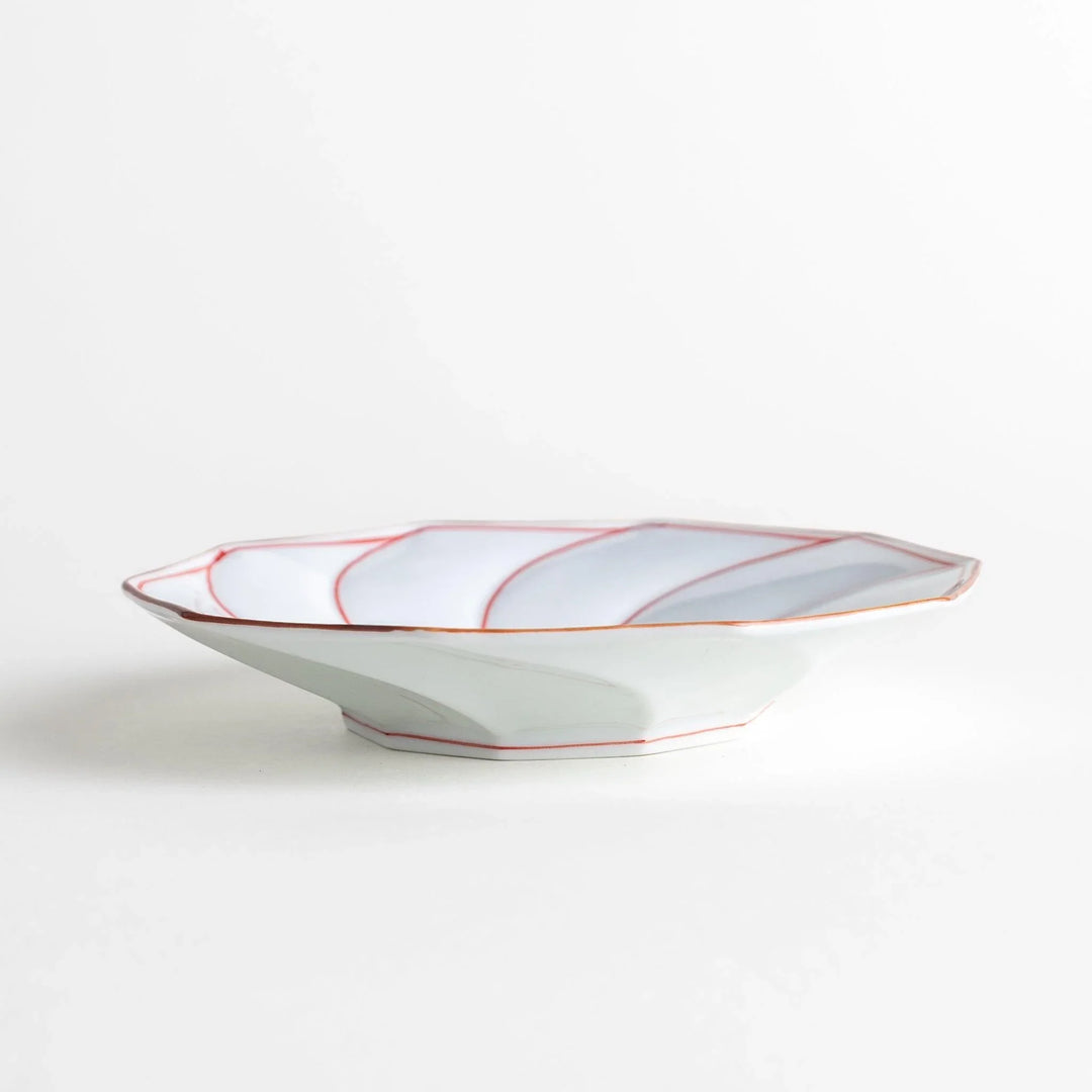 Medium-sized octagonal salad plate with a petal design and bowl shape, outlined in blue and red with a brown rim.