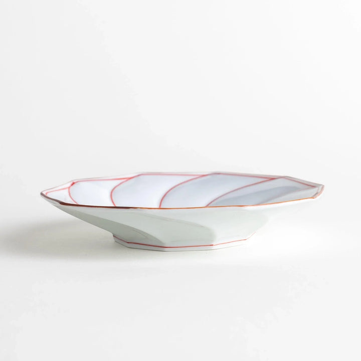 Medium-sized octagonal salad plate with a petal design and bowl shape, outlined in blue and red with a brown rim.