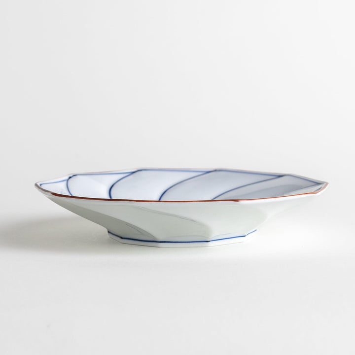 Medium-sized octagonal salad plate with a petal design and bowl shape, outlined in blue and red with a brown rim.