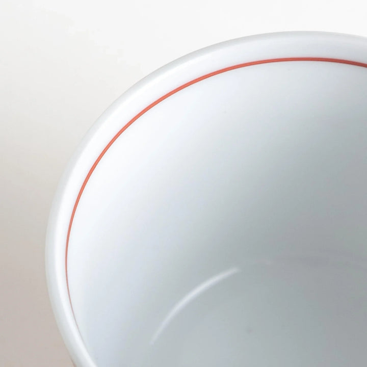 A small condiment bowl adorned with a blue or red geometric lattice pattern, providing a classic and intricate look.