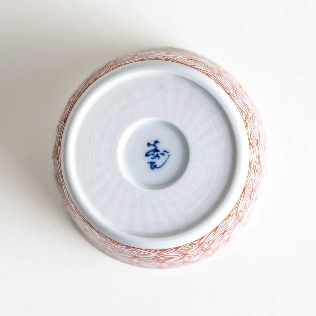 A small condiment bowl adorned with a blue or red geometric lattice pattern, providing a classic and intricate look.