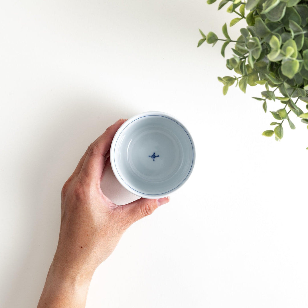 A small condiment bowl adorned with a blue or red geometric lattice pattern, providing a classic and intricate look.