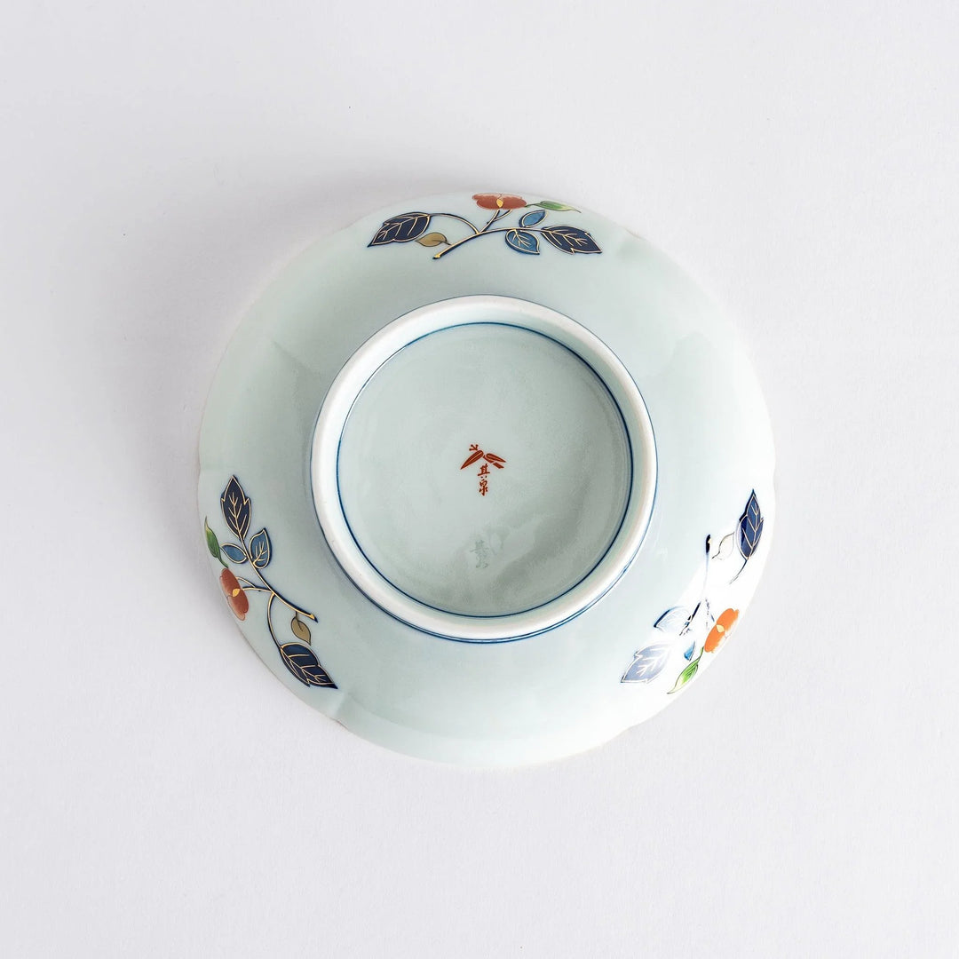 Floral salad plate with gold detailing and red flower center surrounded by green blue and gold patterns.