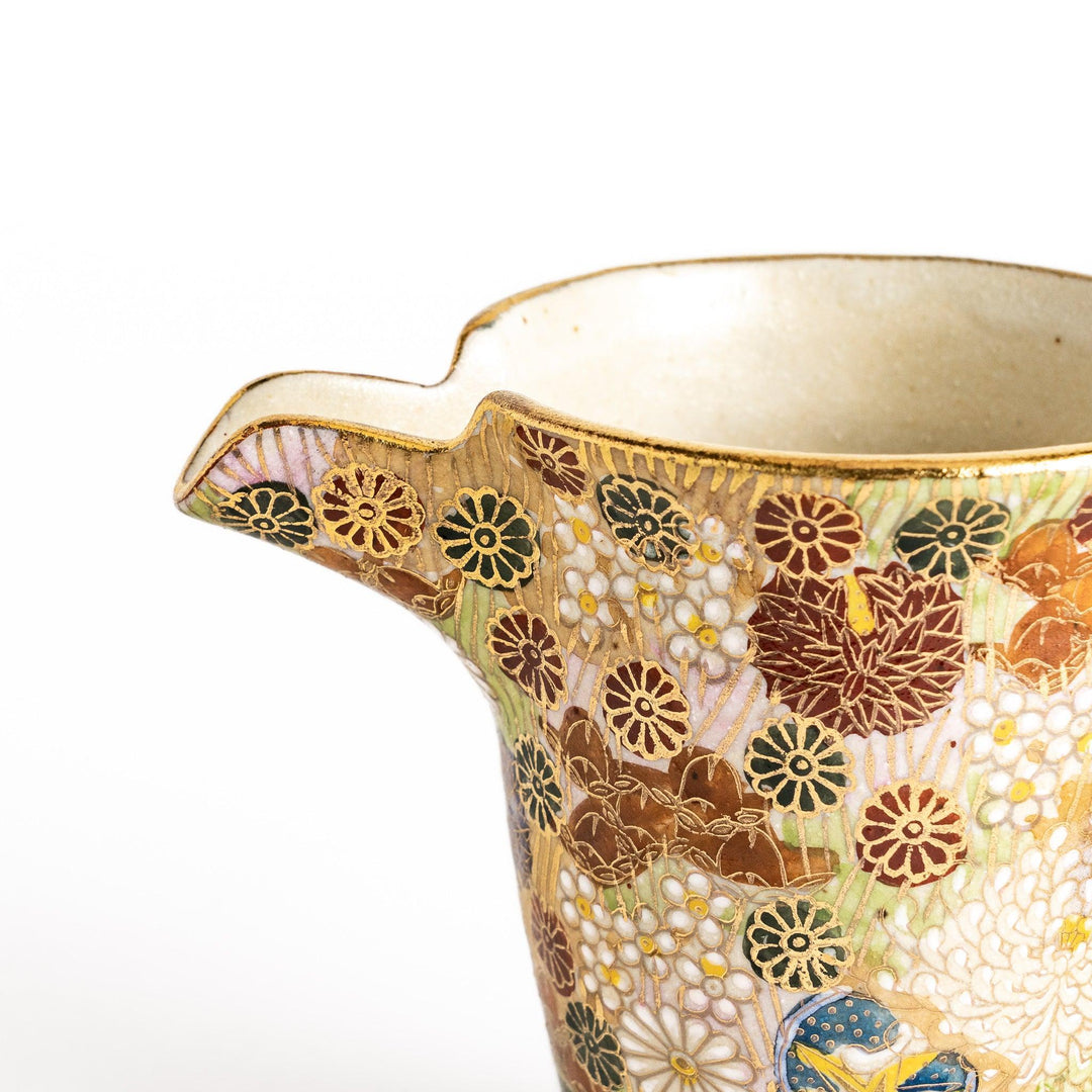 Elegant ceramic sake carafe with gold and pastel floral pattern adding sophistication to sake serving.