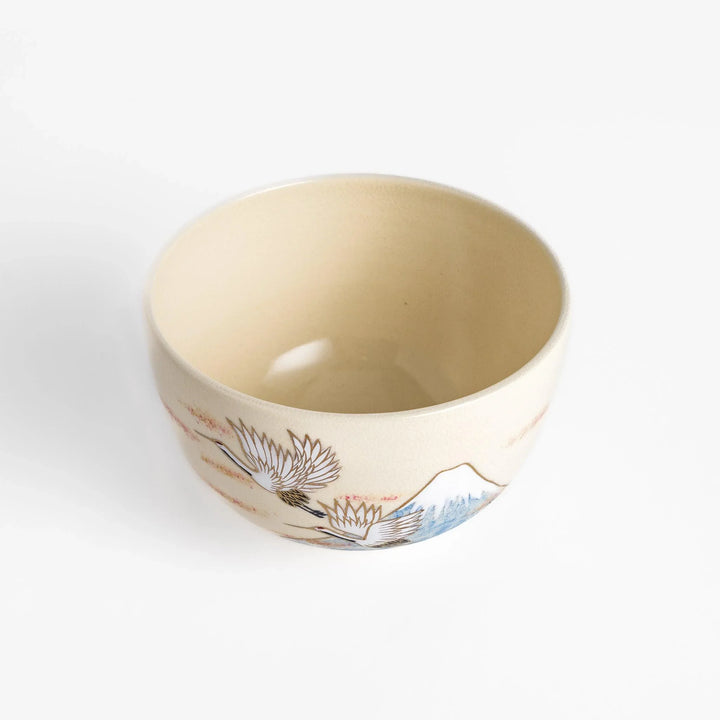 Matcha bowl featuring Mount Fuji and flying cranes with gold accents, adding luxury and tradition to tea ceremonies.