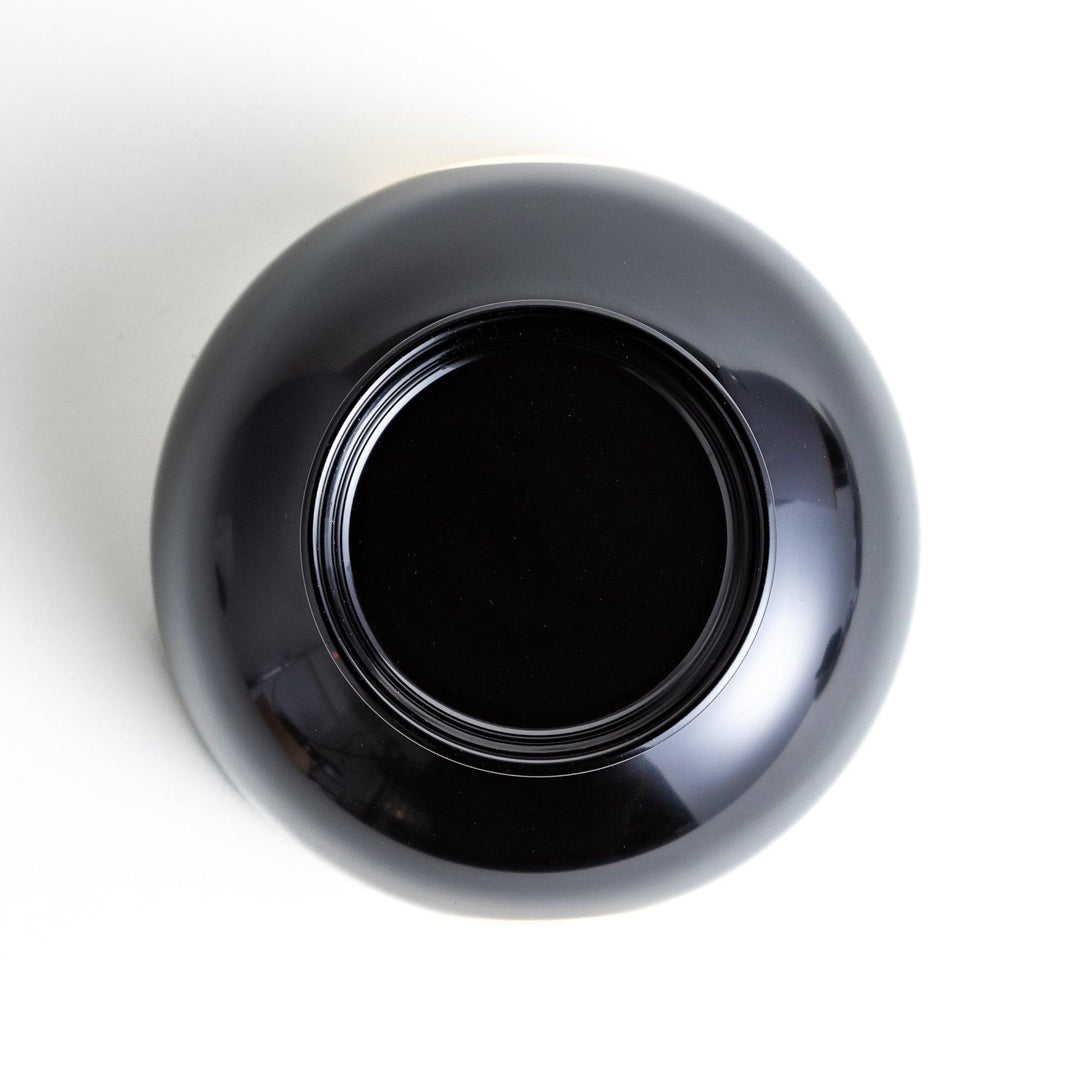 Traditional black lacquer bowl with a golden moon motif on the exterior, featuring a smooth, glossy finish.