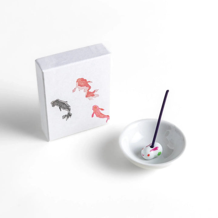 Incense with deep purple sticks in a goldfish design box offering a tranquil refreshing fragrance inspired by summer.