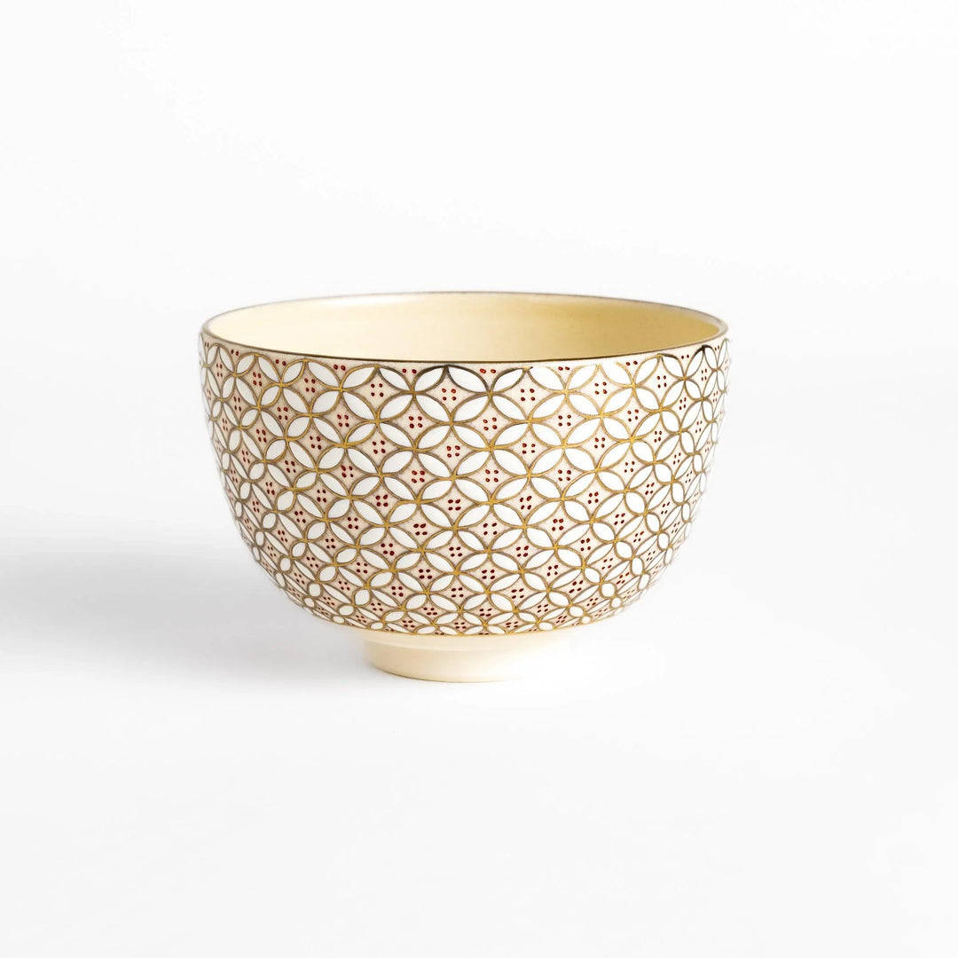 Golden matcha bowl with geometric gold and red design, combining traditional Japanese elegance with modern artistry.
