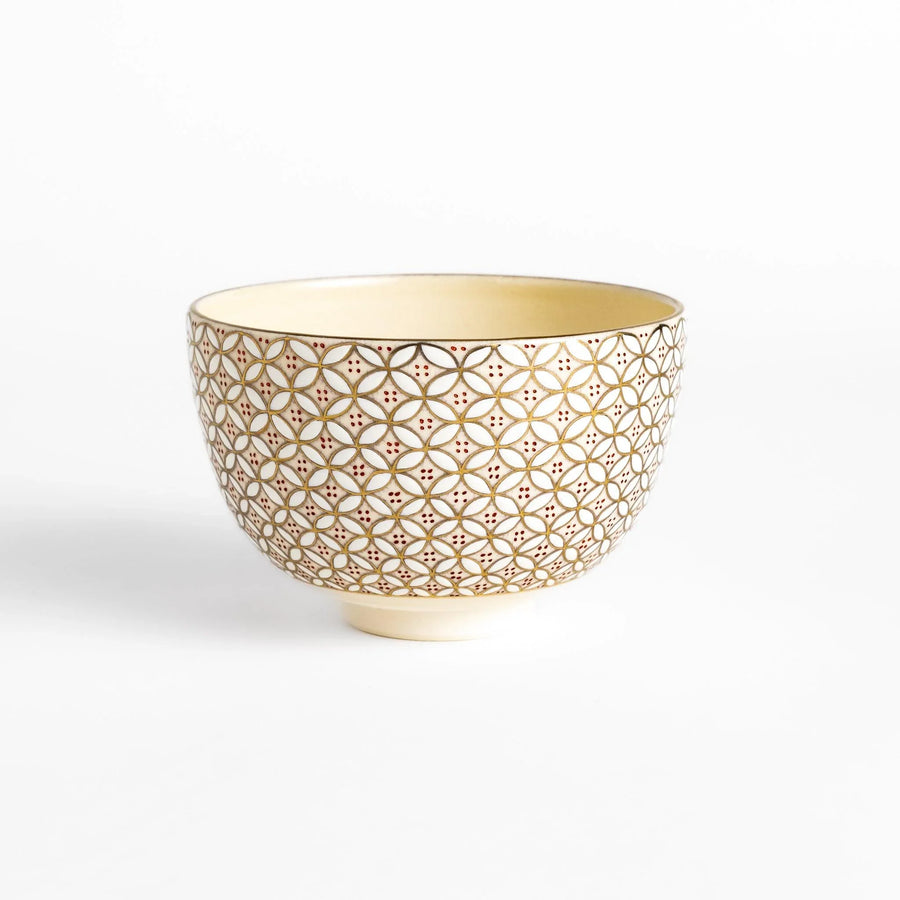 Golden matcha bowl with geometric gold and red design, combining traditional Japanese elegance with modern artistry.