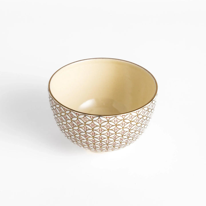 Golden matcha bowl with geometric gold and red design, combining traditional Japanese elegance with modern artistry.