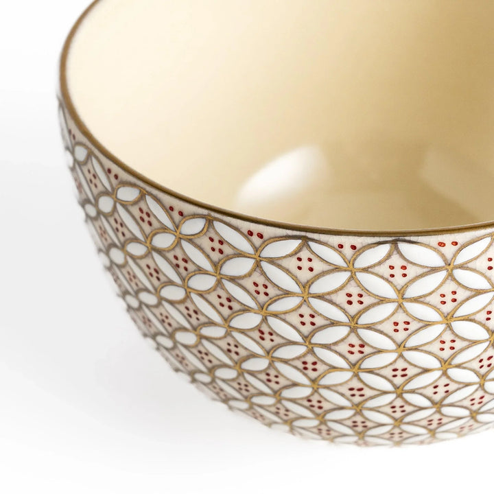 Golden matcha bowl with geometric gold and red design, combining traditional Japanese elegance with modern artistry.