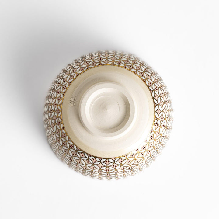 Golden matcha bowl with geometric gold and red design, combining traditional Japanese elegance with modern artistry.