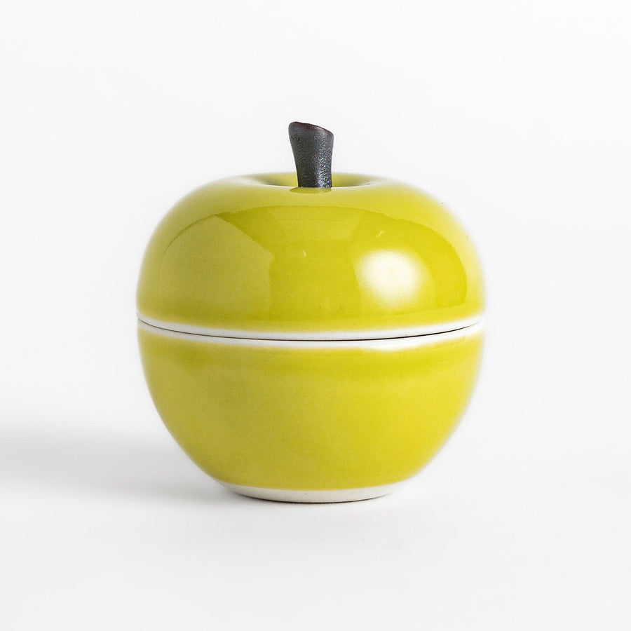 Green apple shaped ceramic condiment bowl with glossy finish and lid perfect for sauces or condiments.