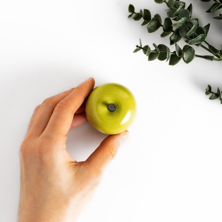 Green apple shaped ceramic condiment bowl with glossy finish and lid perfect for sauces or condiments.