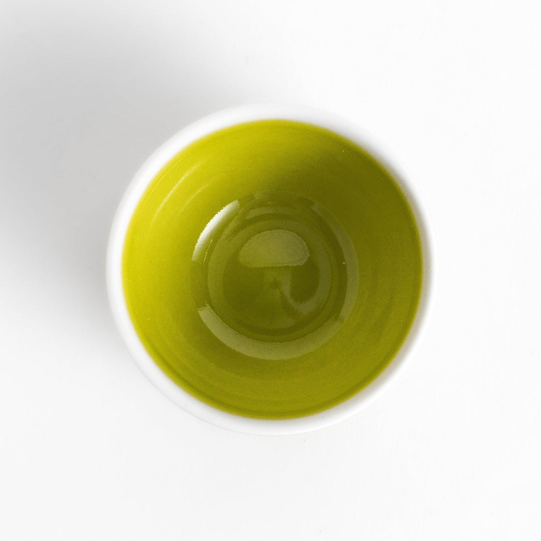 Green apple shaped ceramic condiment bowl with glossy finish and lid perfect for sauces or condiments.
