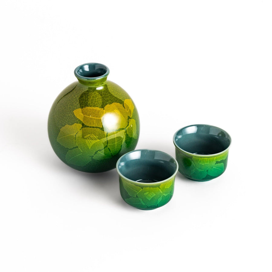 Green ceramic sake set with subtle leaf motif including bottle and cups ideal for traditional sake.