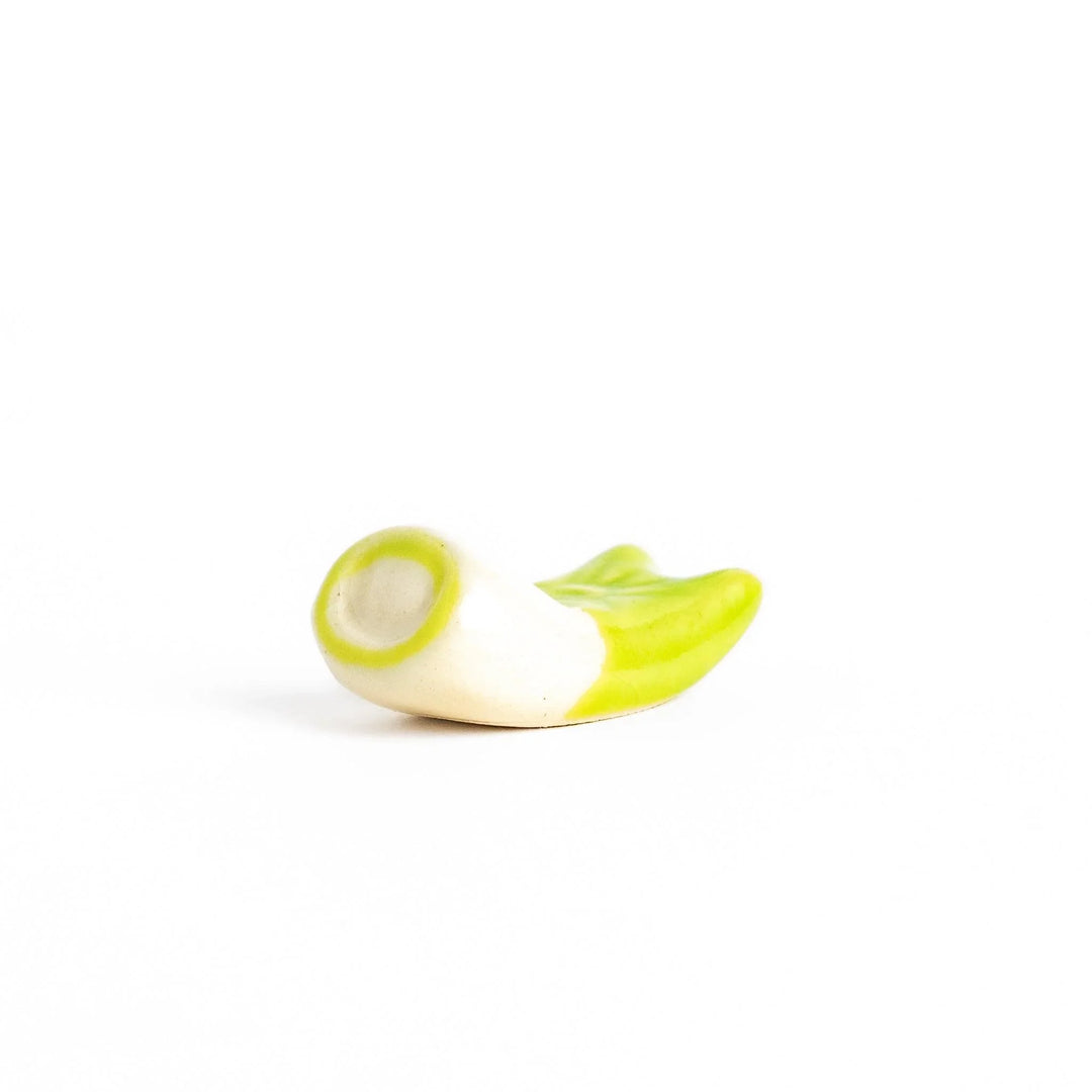 Green carp streamer chopstick rest with a playful yellow eye design.