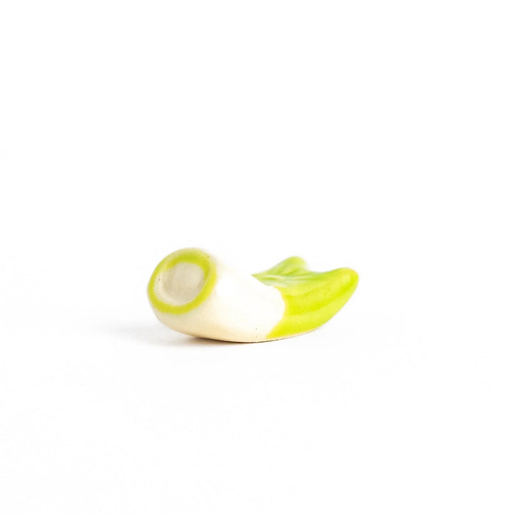 Green carp streamer chopstick rest with a playful yellow eye design.