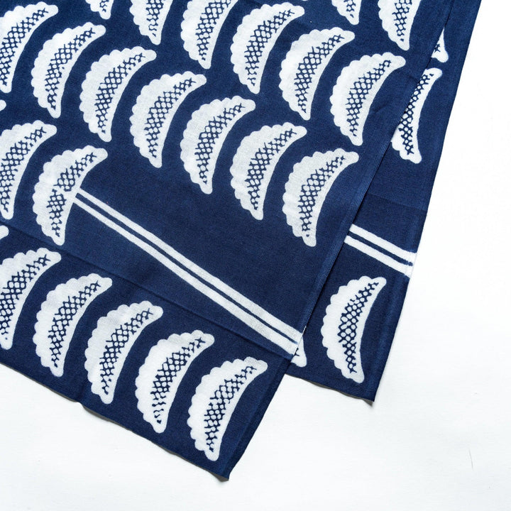 Navy tenugui with white gyoza pattern spread flat showing detailed design on white background.