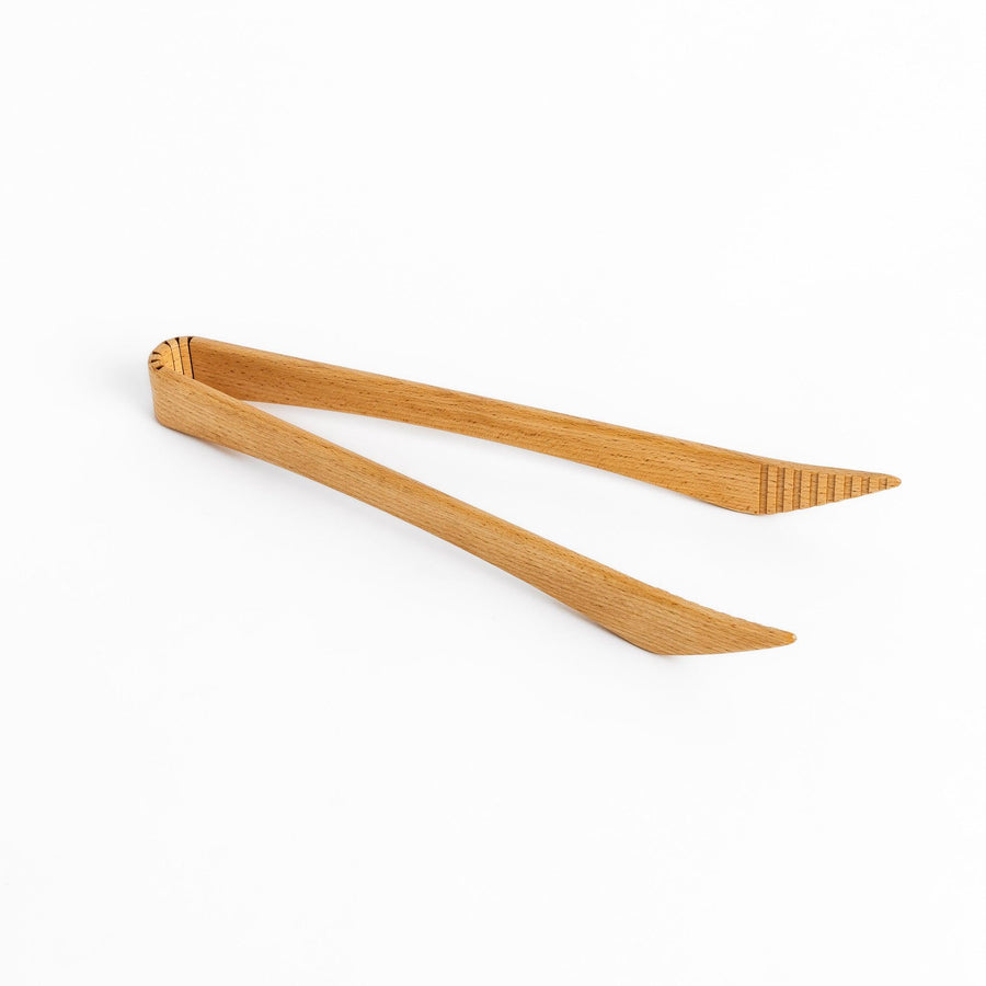 Elegant handcrafted wooden tongs with a smooth finish and angled tips, perfect for serving and handling food in a stylish way.