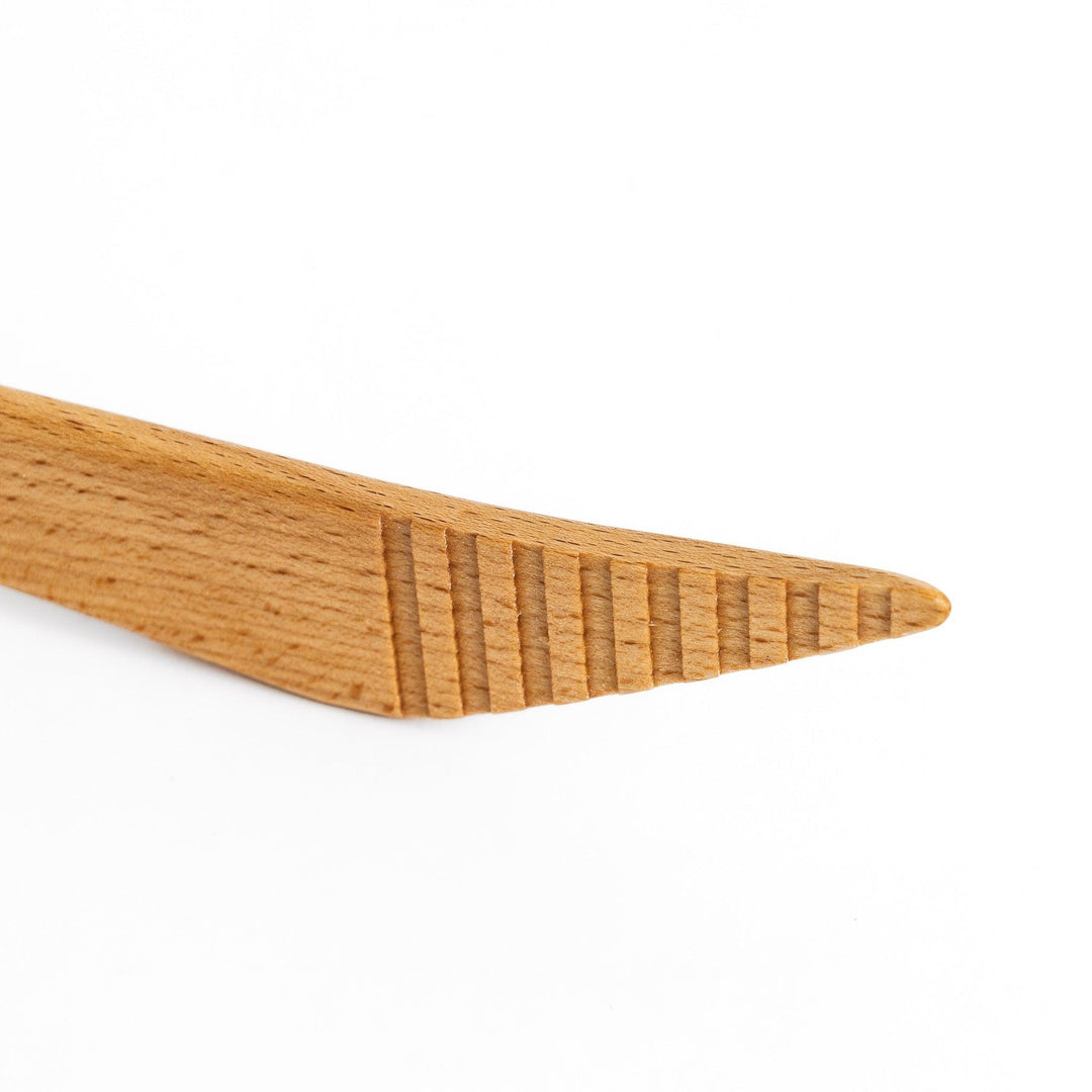 Elegant handcrafted wooden tongs with a smooth finish and angled tips, perfect for serving and handling food in a stylish way.