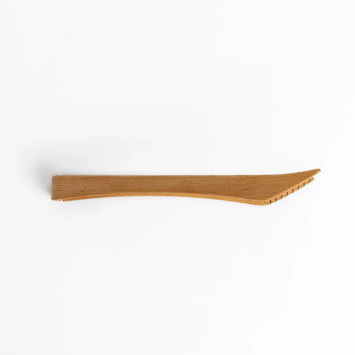 Handcrafted wooden tongs with a smooth surface and angled tips, perfect for stylishly serving or handling food.