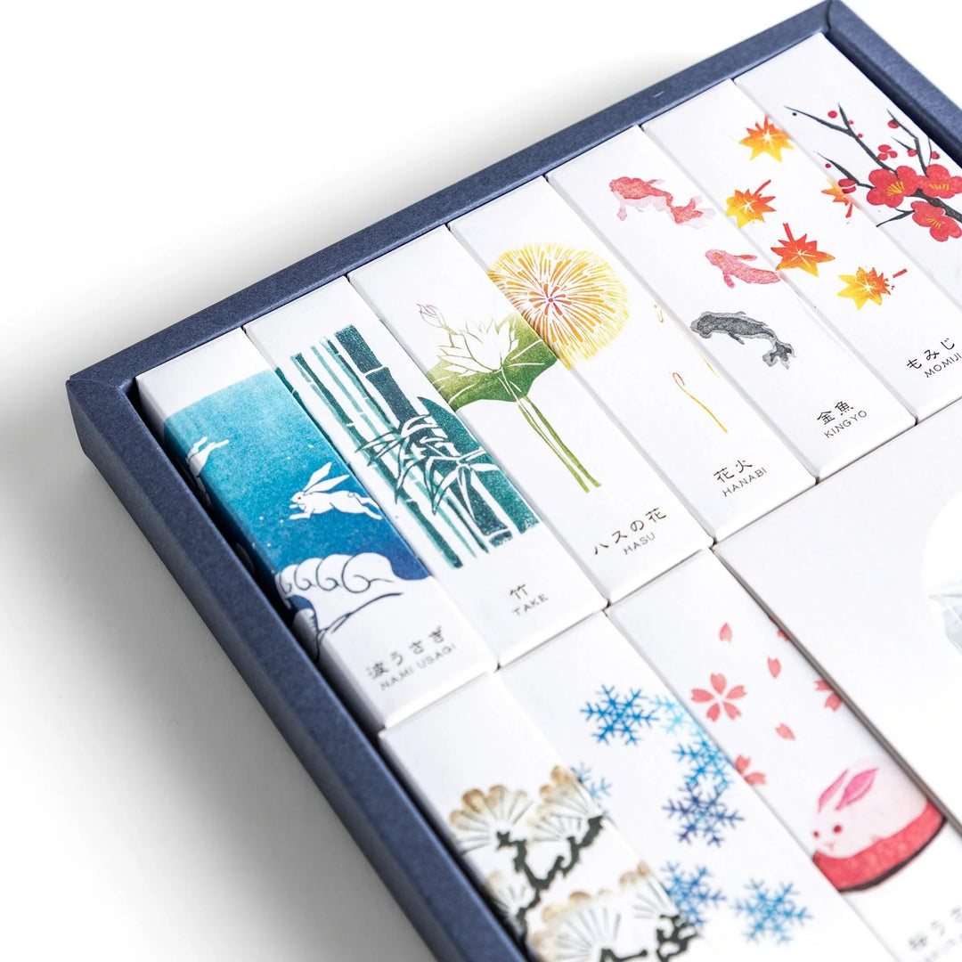 Japanese incense gift set of ten boxes with nature inspired scents and ceramic holder for elegant use.