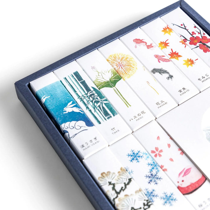 Japanese incense gift set of ten boxes with nature inspired scents and ceramic holder for elegant use.