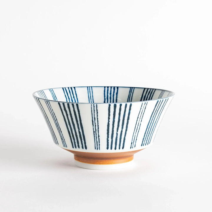 Ceramic ramen bowl with blue striped pattern on white background.