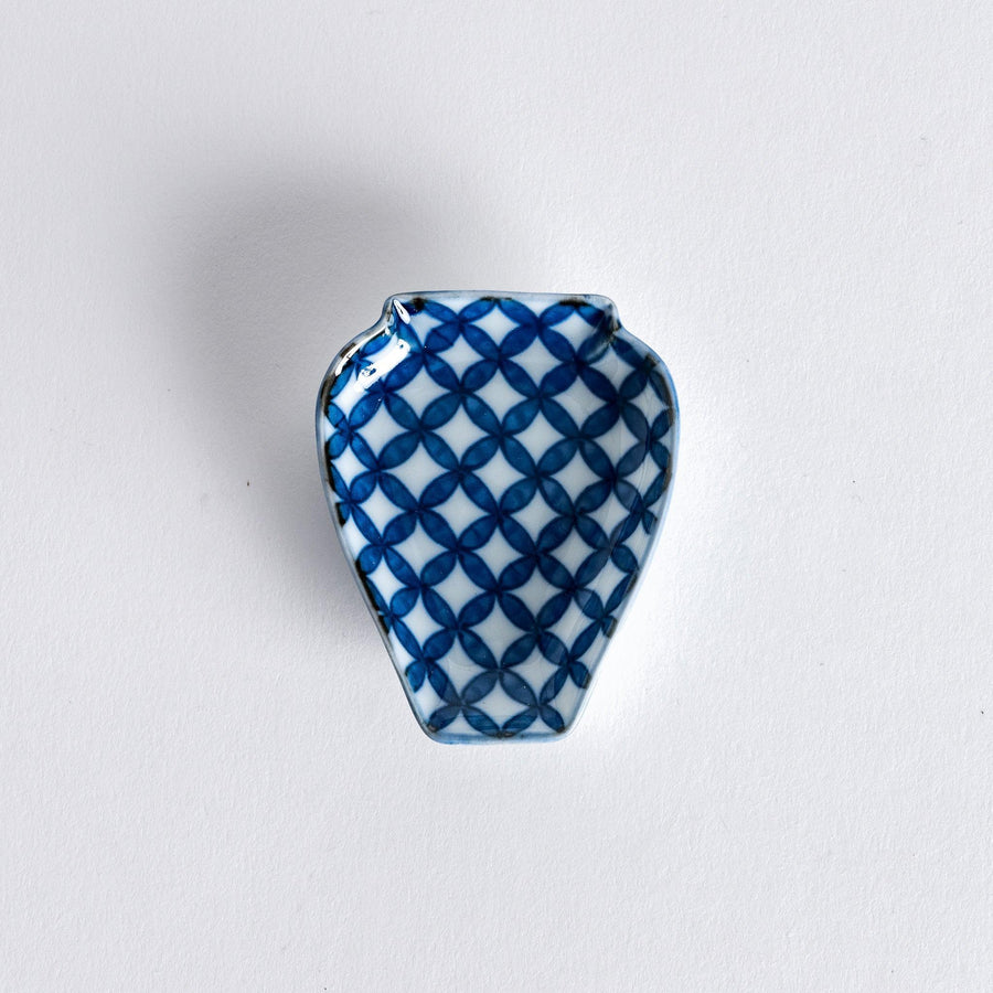 Small Japanese vase shaped dish with blue geometric interlocking circle pattern for condiments or decor.