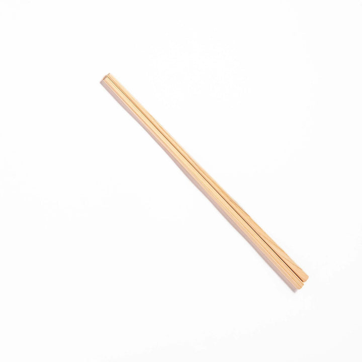 Pair of hinoki wood cooking chopsticks with smooth light wood grain and tapered ends, ideal for Japanese cuisine