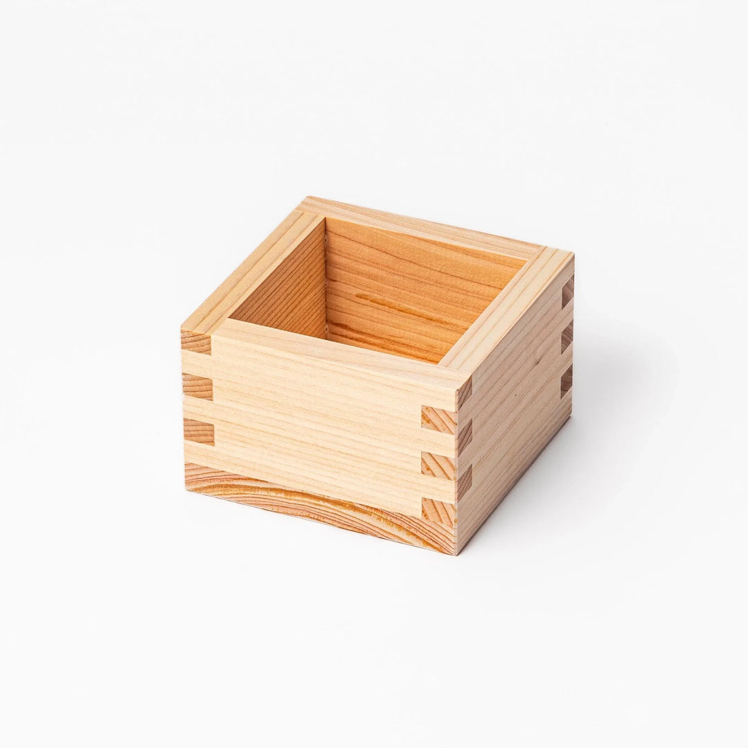Hinoki wood masu sake cup with visible joinery, offering a natural aroma for sake or condiments.
