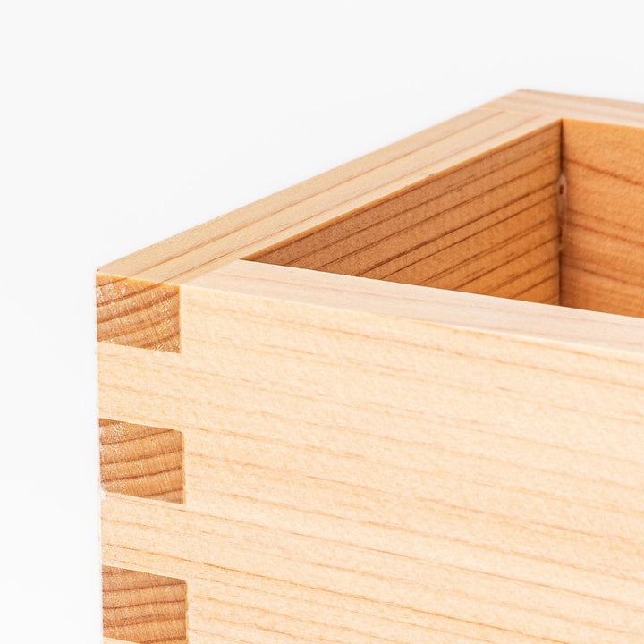 Hinoki wood masu sake cup with visible joinery, offering a natural aroma for sake or condiments.