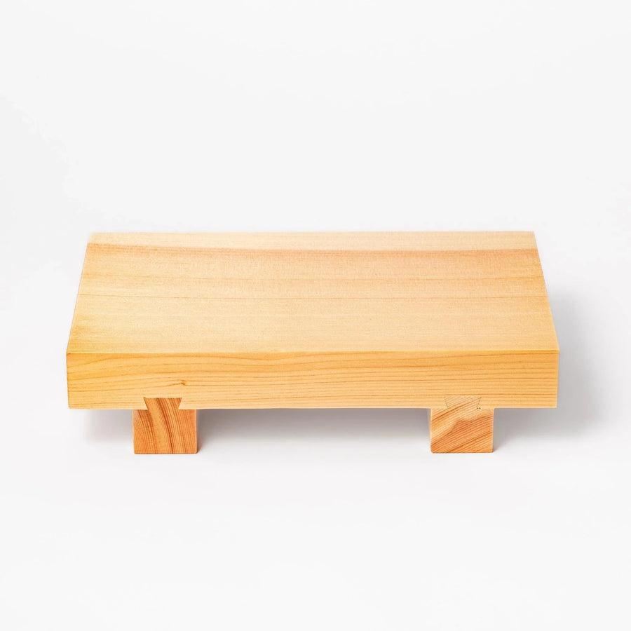 Rectangular hinoki wood sushi plate with raised legs perfect for serving sushi or appetizers elegantly.