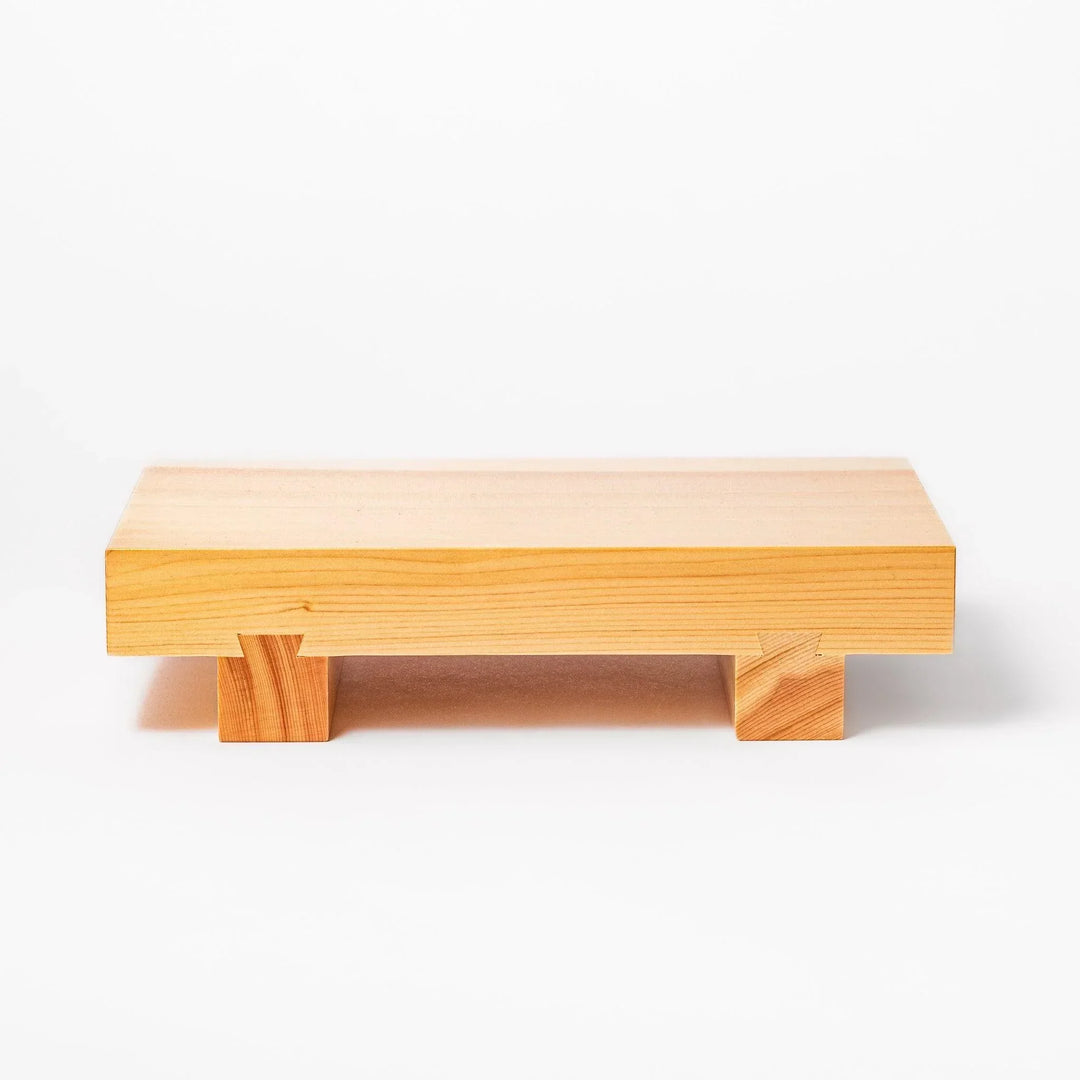 Rectangular hinoki wood sushi plate with raised legs perfect for serving sushi or appetizers elegantly.