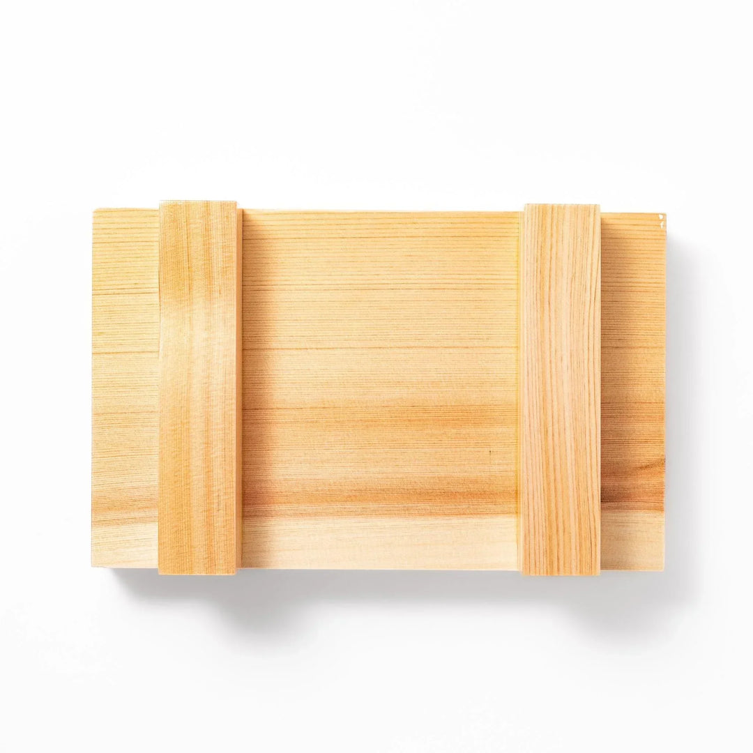 Rectangular hinoki wood sushi plate with raised legs perfect for serving sushi or appetizers elegantly.