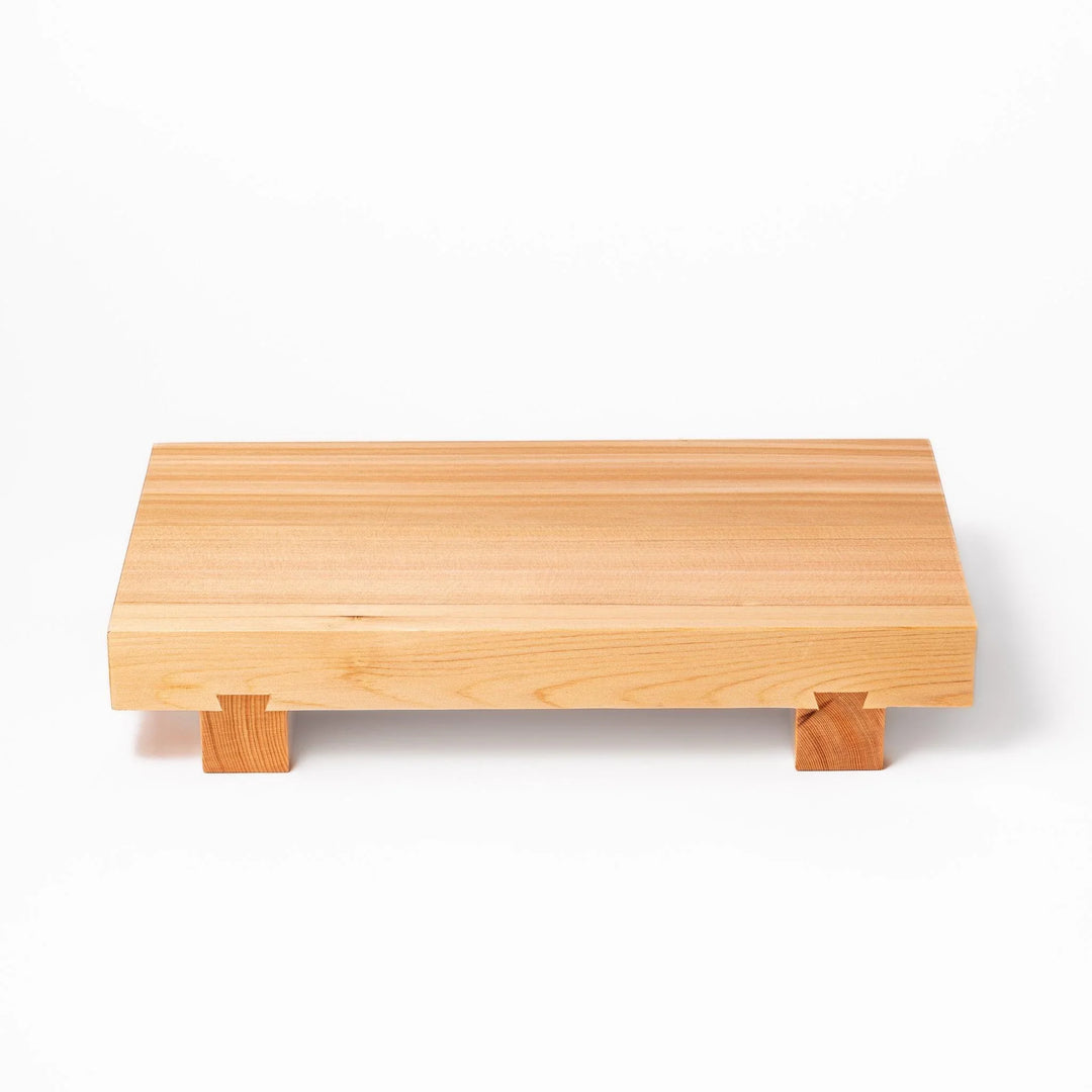 Elevated hinoki wood sushi plate with natural grain and joinery ideal for refined Japanese presentation.