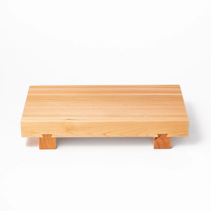 Elevated hinoki wood sushi plate with natural grain and joinery ideal for refined Japanese presentation.