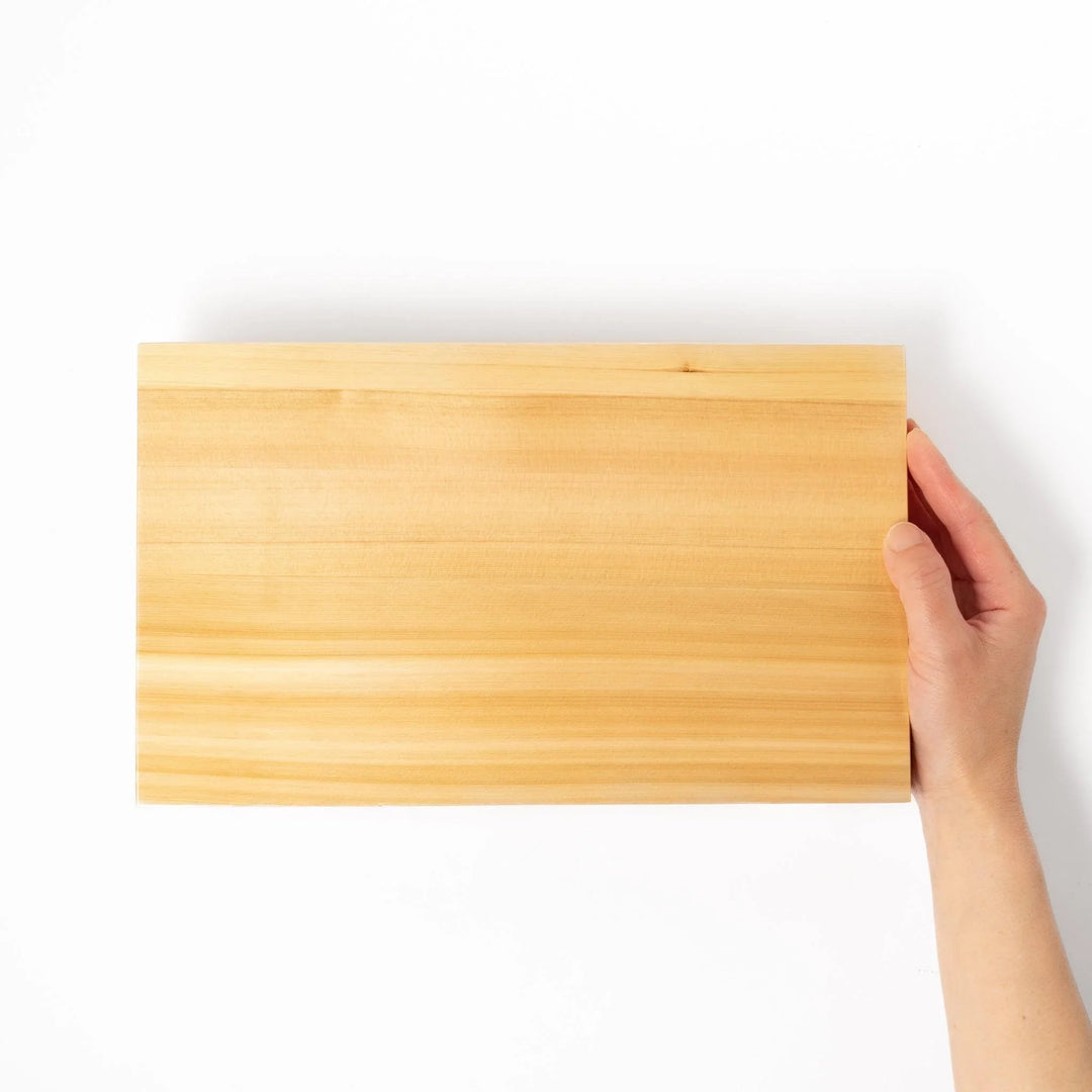 Elevated hinoki wood sushi plate with natural grain and joinery ideal for refined Japanese presentation.