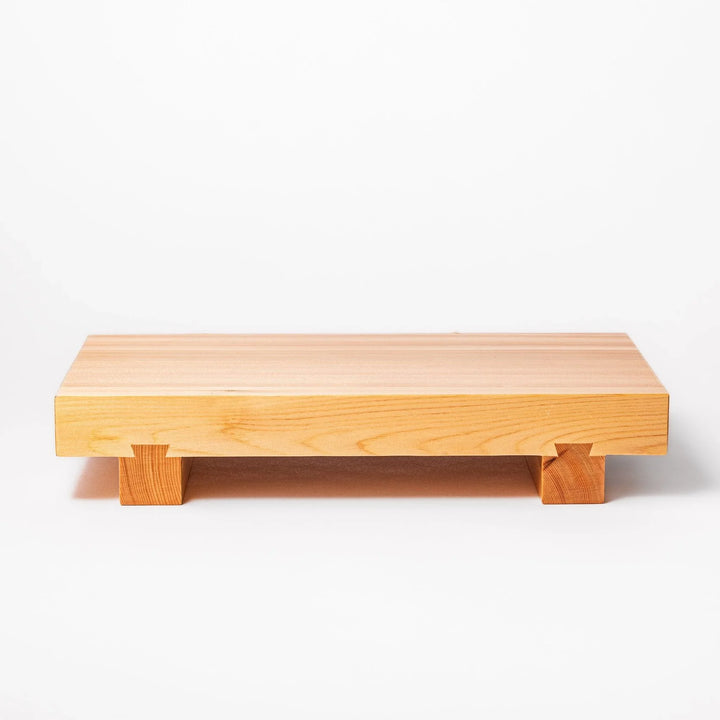 Elevated hinoki wood sushi plate with natural grain and joinery ideal for refined Japanese presentation.