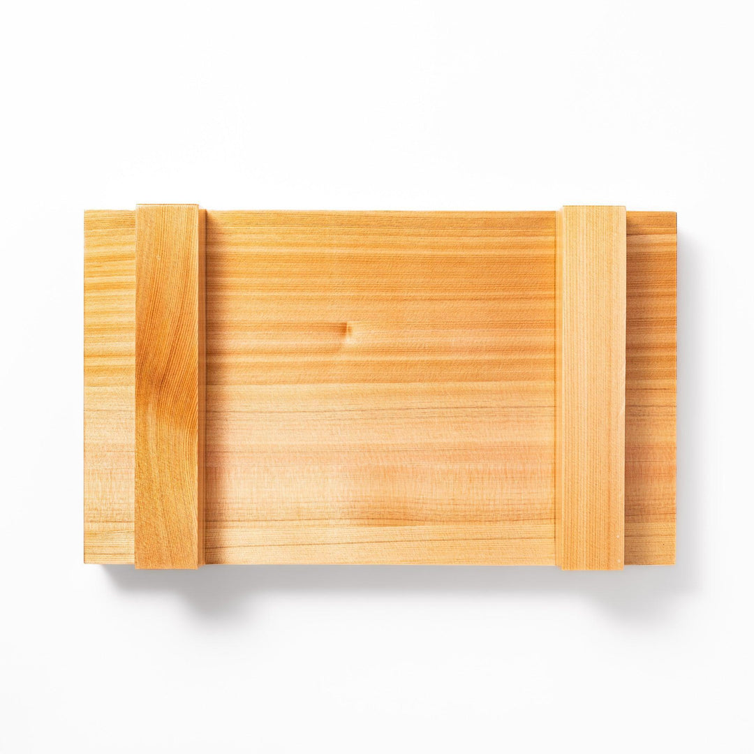 Elevated hinoki wood sushi plate with natural grain and joinery ideal for refined Japanese presentation.