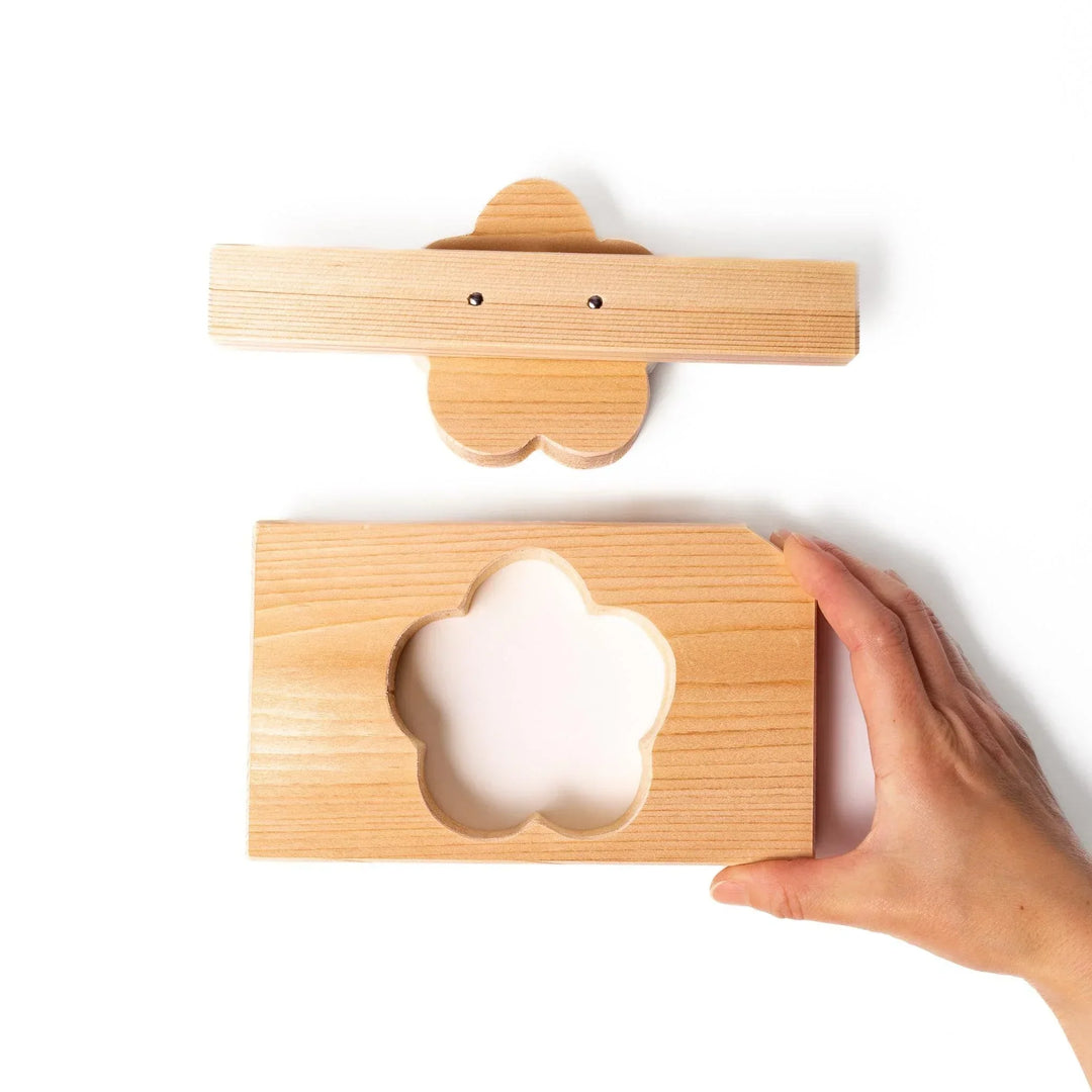 Hinoki onigiri mold in plum blossom shape, perfect for pressing rice into floral forms with a light, natural aroma.